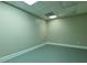 A spacious unfinished basement features epoxy floor and a drop ceiling with recessed lights at 6310 Talking Tree Ct, Cumming, GA 30028