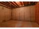 Unfinished basement with bare concrete walls and ceiling beams at 6310 Talking Tree Ct, Cumming, GA 30028