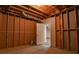 Unfinished basement with exposed wood beams and ductwork at 6310 Talking Tree Ct, Cumming, GA 30028