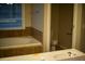Bathroom with a large tub and separate toilet room at 6310 Talking Tree Ct, Cumming, GA 30028
