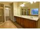 Bathroom featuring double sinks, white countertop, and glass enclosed shower at 6310 Talking Tree Ct, Cumming, GA 30028