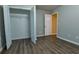 Cozy bedroom featuring luxury vinyl floors and a closet at 6310 Talking Tree Ct, Cumming, GA 30028
