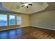 Bright bedroom with natural light and dark wood floors at 6310 Talking Tree Ct, Cumming, GA 30028