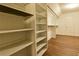 Spacious walk-in closet with built-in shelving and hanging racks at 6310 Talking Tree Ct, Cumming, GA 30028
