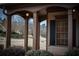 Inviting front porch with stately columns, offering a cozy outdoor space at 6310 Talking Tree Ct, Cumming, GA 30028