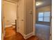 View of hallway with half bath and bedroom visible from open doorways at 6310 Talking Tree Ct, Cumming, GA 30028