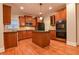 Spacious kitchen featuring an island, stainless steel appliances, granite counters, and ample cabinet space at 6310 Talking Tree Ct, Cumming, GA 30028