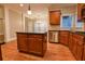Well-equipped kitchen with stainless steel appliances, granite countertops, and a functional center island at 6310 Talking Tree Ct, Cumming, GA 30028