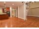Open floor plan with hardwood floors that connect the kitchen to the spacious living area at 6310 Talking Tree Ct, Cumming, GA 30028