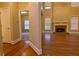 Spacious living room with hardwood floors and fireplace at 6310 Talking Tree Ct, Cumming, GA 30028