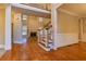 Bright living room with hardwood floors, fireplace, and staircase at 6310 Talking Tree Ct, Cumming, GA 30028