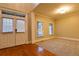 Inviting living room featuring hardwood floors, bright windows, and double doors at 6310 Talking Tree Ct, Cumming, GA 30028