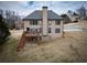 Spacious backyard featuring a deck and lush landscaping at 6310 Talking Tree Ct, Cumming, GA 30028