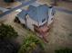 Aerial view of the home with an outdoor deck and patio at 6310 Talking Tree Ct, Cumming, GA 30028