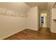 Walk-in closet with wood-look floors and metal rack at 6310 Talking Tree Ct, Cumming, GA 30028