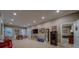 Spacious finished basement with game area, media, bar, and walkout access, perfect for entertaining or recreation at 9070 Huntcliff Trce, Sandy Springs, GA 30350