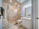 Bathroom featuring glass enclosed shower and a single sink vanity at 9070 Huntcliff Trce, Sandy Springs, GA 30350