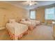 Bedroom featuring three beds, carpet, white trim, and wall art at 9070 Huntcliff Trce, Sandy Springs, GA 30350