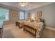Bedroom featuring two twin beds with floral bedding, carpeted floors, and windows with blinds at 9070 Huntcliff Trce, Sandy Springs, GA 30350
