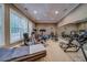 Home gym featuring workout equipment, mirrors and natural light at 9070 Huntcliff Trce, Sandy Springs, GA 30350