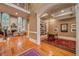 Spacious living room with hardwood floors, a fireplace, and ample natural light at 9070 Huntcliff Trce, Sandy Springs, GA 30350