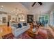 A cozy living room flows openly to the kitchen and breakfast nook at 9070 Huntcliff Trce, Sandy Springs, GA 30350