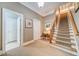 Staircase featuring carpeted steps and wooden banister at 9070 Huntcliff Trce, Sandy Springs, GA 30350