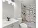 Modern bathroom with a walk-in shower, vanity, and stylish finishes at 1428 Muirfield Dr, Stone Mountain, GA 30088