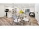 Charming dining area with a glass table and modern chairs adjacent to the bright kitchen at 1428 Muirfield Dr, Stone Mountain, GA 30088