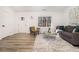 Bright living room with a modern design including a stylish grey sofa and eye-catching rug at 1428 Muirfield Dr, Stone Mountain, GA 30088
