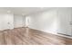 Spacious room showcasing wood-look flooring, recessed lighting, and a white door at 1428 Muirfield Dr, Stone Mountain, GA 30088