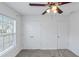 The bedroom has natural light, a ceiling fan, and closet space at 509 Mullein Trce, Woodstock, GA 30188