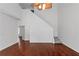 Open living room area with hardwood floors and staircase at 509 Mullein Trce, Woodstock, GA 30188