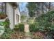 Cozy backyard area with manicured greenery, gravel space, and charming garden landscape at 6 Arden Moor Nw, Atlanta, GA 30305