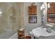 Updated bathroom with tub/shower combination, custom sink, and stylish decor at 6 Arden Moor Nw, Atlanta, GA 30305