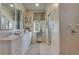 Elegant bathroom with dual sinks, decorative mirrors, and patterned wallpaper at 6 Arden Moor Nw, Atlanta, GA 30305