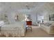 Comfortable bedroom with patterned wallpaper, neutral furniture and natural light at 6 Arden Moor Nw, Atlanta, GA 30305