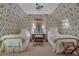 Charming bedroom featuring twin beds, wallpaper, and a window seat at 6 Arden Moor Nw, Atlanta, GA 30305
