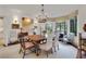 Formal dining room boasts a chandelier, large window, and ample seating for elegant entertaining at 6 Arden Moor Nw, Atlanta, GA 30305