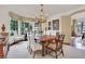 Bright dining room with a chandelier, large window and light colored walls at 6 Arden Moor Nw, Atlanta, GA 30305