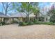 Beautiful home with covered walkway and garage, nestled in a well-manicured, green landscape at 6 Arden Moor Nw, Atlanta, GA 30305