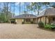 Charming home featuring stone driveway, lush landscaping, and distinctive architecture at 6 Arden Moor Nw, Atlanta, GA 30305