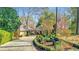 Gorgeous home with attached portico and circular driveway with mature landscaping at 6 Arden Moor Nw, Atlanta, GA 30305