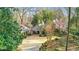 Charming home with a beautifully landscaped front yard and covered entryway at 6 Arden Moor Nw, Atlanta, GA 30305