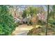 Charming home with landscaped front yard, detached garage and covered portico at 6 Arden Moor Nw, Atlanta, GA 30305