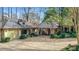 View of the charming home with a detached garage and covered portico at 6 Arden Moor Nw, Atlanta, GA 30305