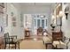 Hallway view of a sitting room with exposed lamps and doorway view to dining area at 6 Arden Moor Nw, Atlanta, GA 30305