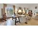 Bright living room with large windows, neutral furniture, and a unique table at 6 Arden Moor Nw, Atlanta, GA 30305