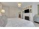 Light-filled main bedroom with fireplace, desk, and backyard views at 6 Arden Moor Nw, Atlanta, GA 30305