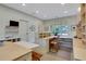 Well-lit office with custom built-in desks, cabinets, and a cozy seating area at 6 Arden Moor Nw, Atlanta, GA 30305